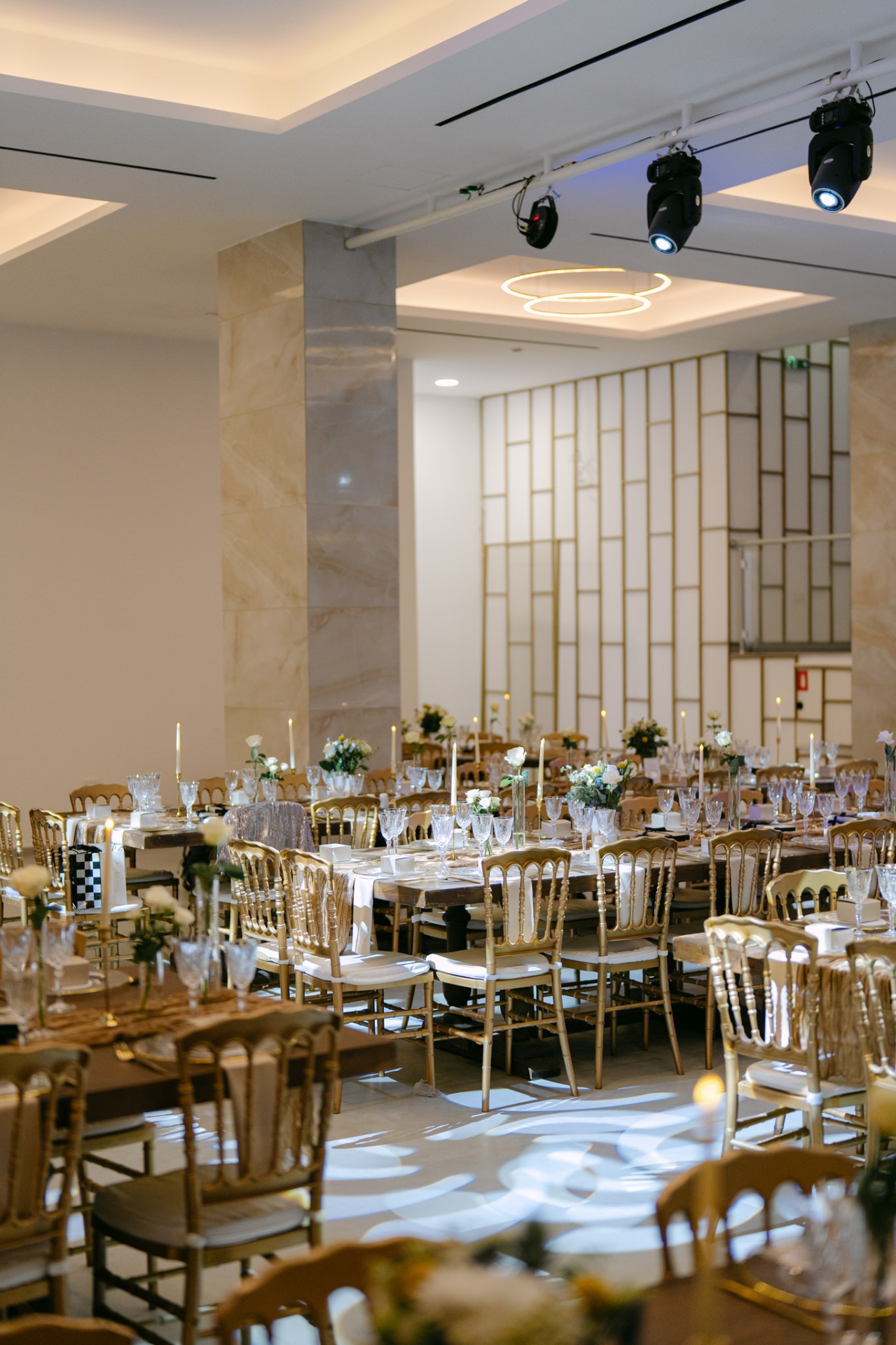 Warm candlelit reception hall at WHITE